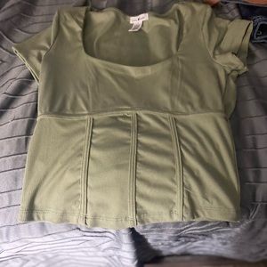 A green crop shirt